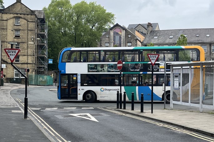 A bus leaving the bus station onto Damside Street